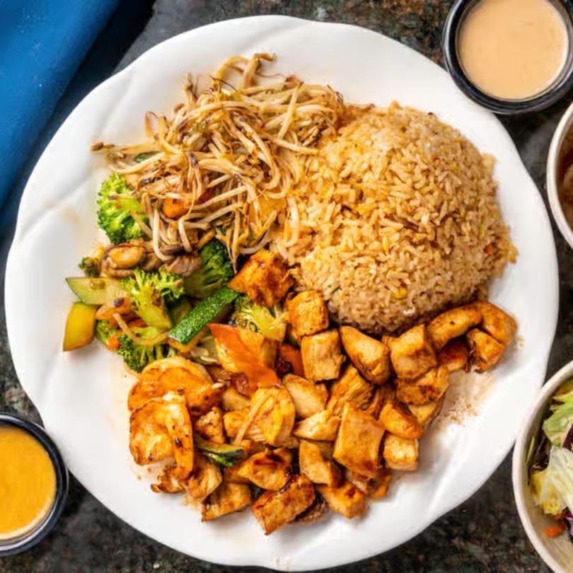 Kyoto Japanese Steak House hibachi chicken and shrimp with fried rice, vegetables, and bean sprouts.