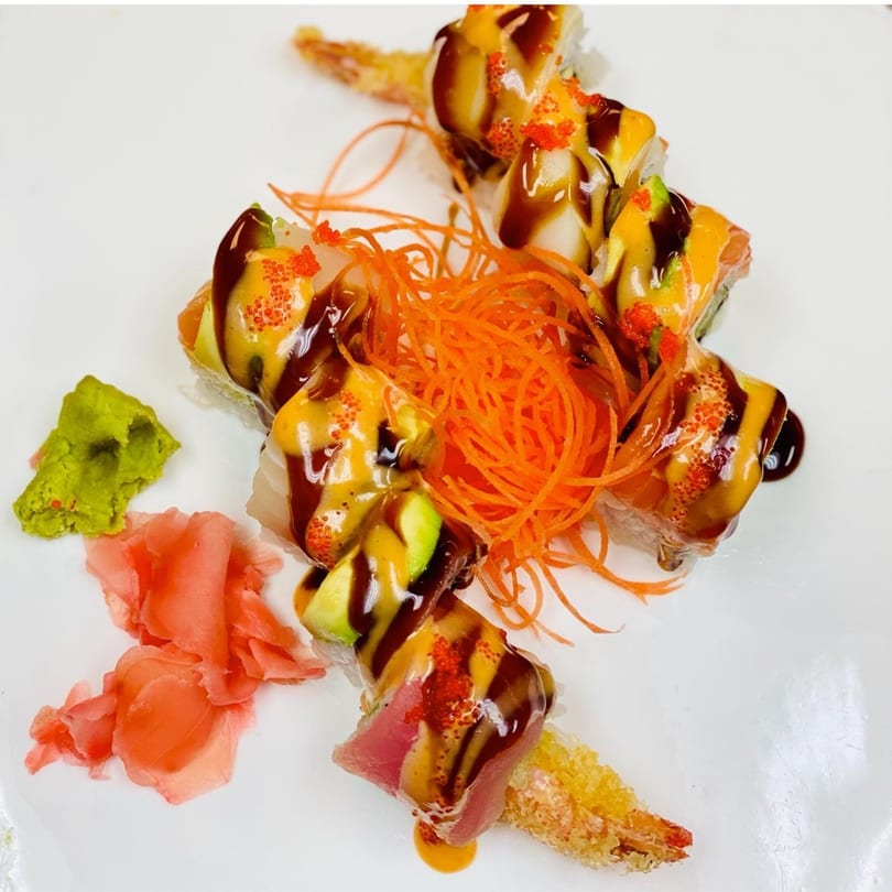 Kyoto Japanese Steak House sushi rolls with shrimp tempura, avocado, tuna, sauces, and roe.
